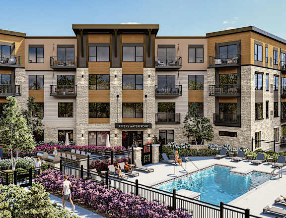 a rendering of an apartment building with a swimming pool